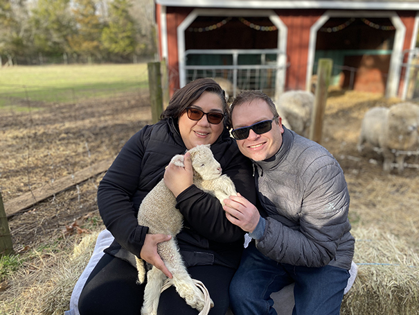 David and Andrea with baby sheep